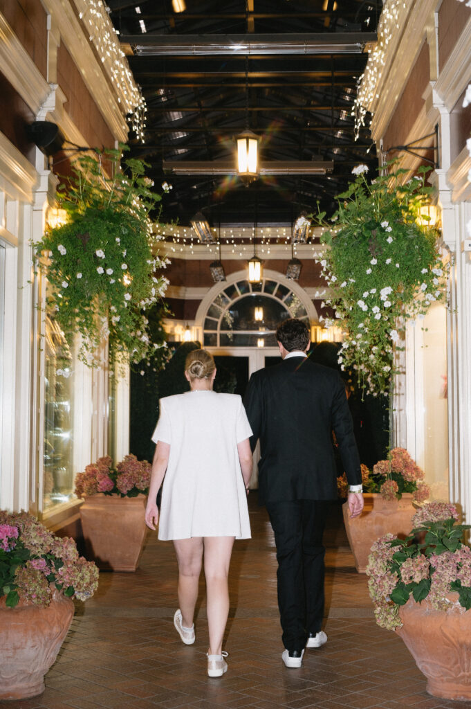 A bride and groom walk into their rehearsal restaurant in Aspen, CO